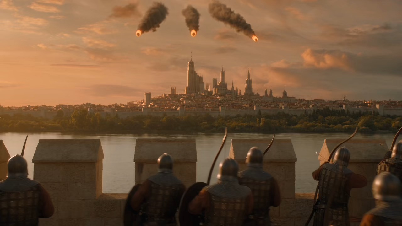Archers on a castle wall as fire rains down