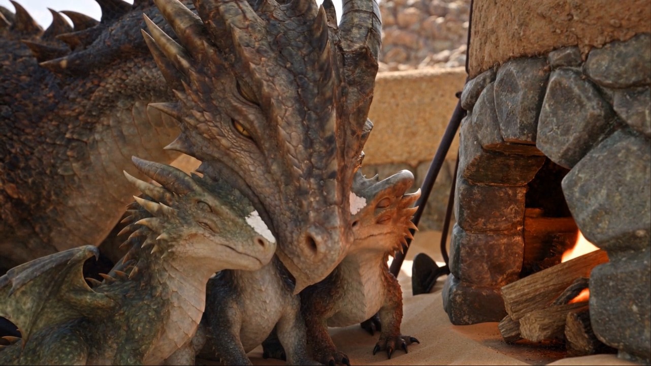 Three dragons make dinner at a stone oven