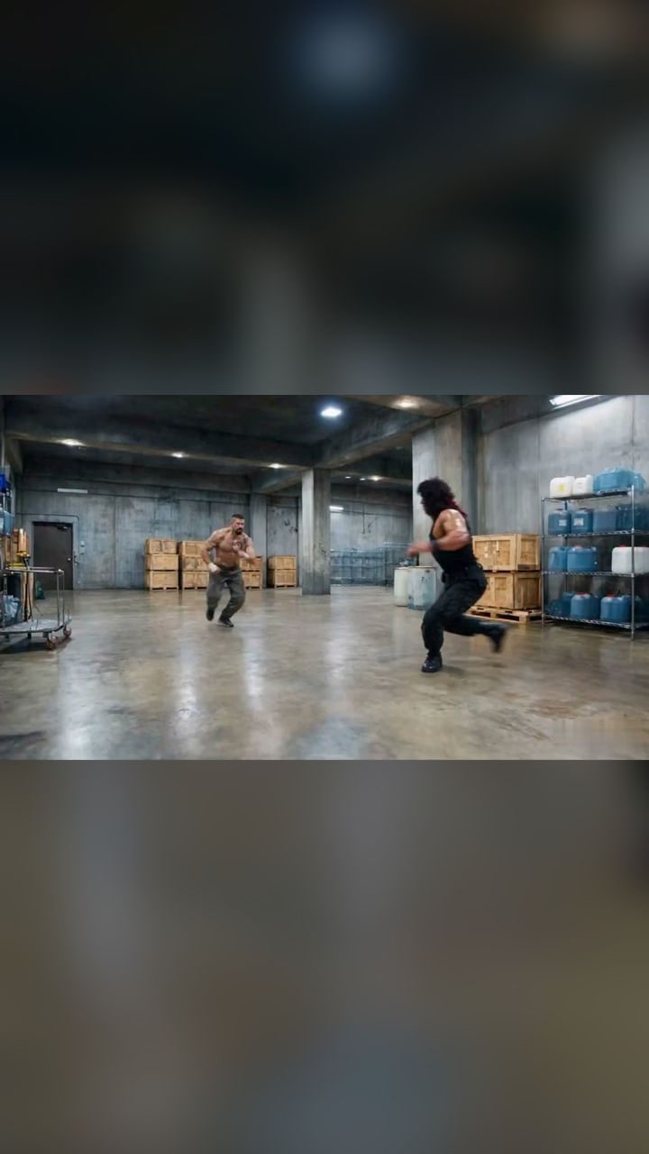 Two action-movie legends trade flying kicks in a warehouse